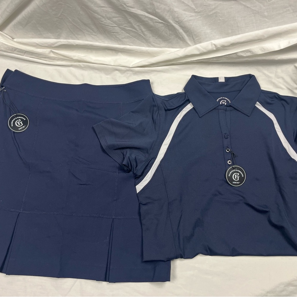 Fairway & Greene Women’s Golf Tech Navy Skort and navy and white polo.